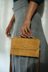 Square clutch with green strap